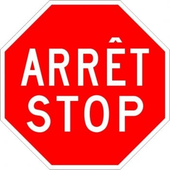 Panneau bilingue d'arrêt-stop